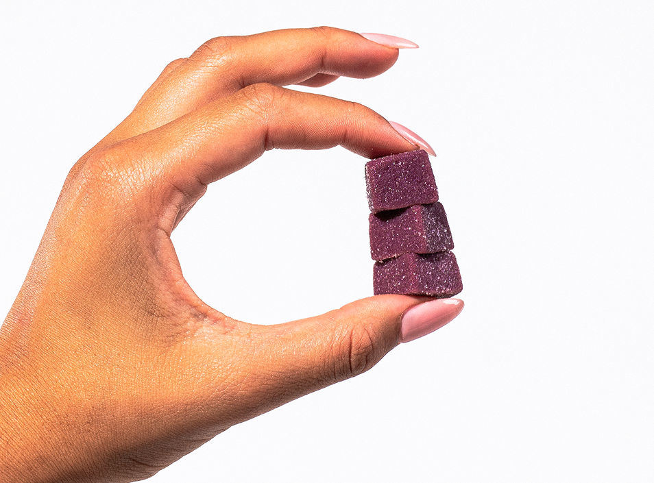 Hand holding Cellev8 SOD Gummies