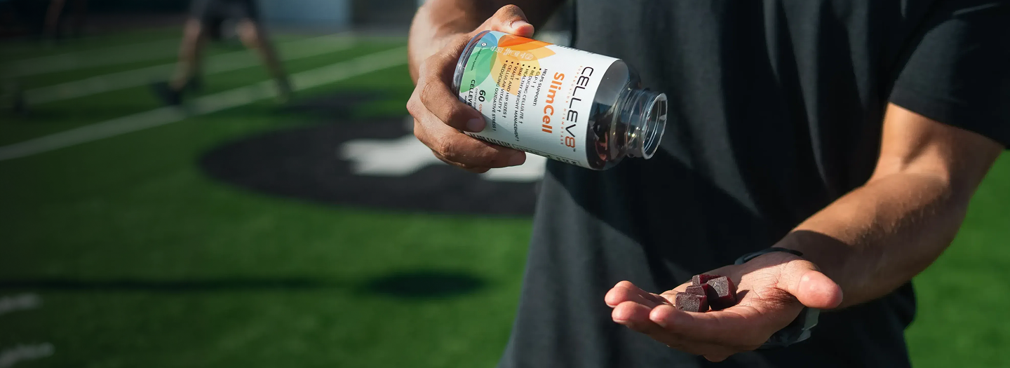 Person holding Cellev8 SlimCell Gummies